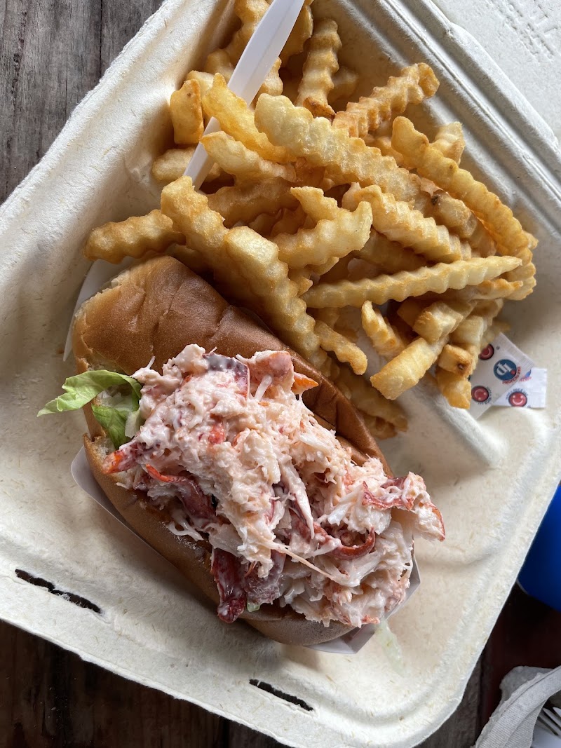 Lobster roll with crinkle-cut fries at Crosby's Drive-In near Acadia National Park, a seaside grill.