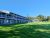 Lodging complex with two-story balconies on a green lawn in Acadia National Park.