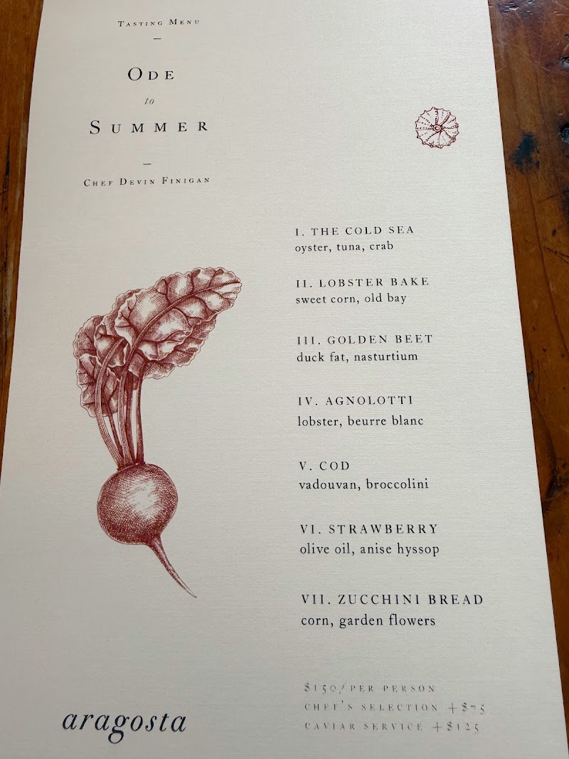 Goose Cove tasting menu page displayed inside a dining scene at Acadia National Park