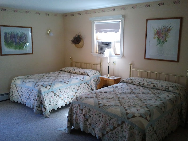Twin-bedroom with patchwork quilts at a historic country inn in Acadia National Park