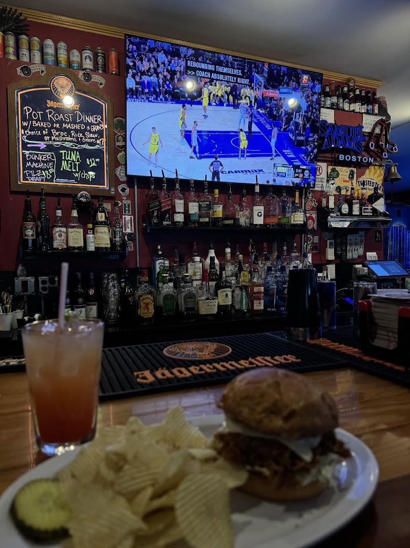 Interior at a bar in Acadia National Park featuring a TV showing basketball.
