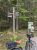 Wooden signpost at a trail junction near Eagle Lake and Jordan Pond House in Acadia National Park.