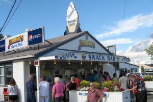 Snack bar exterior at Acadia National Park along a busy roadside, with visitors waiting.