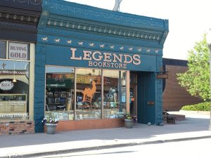 Gift shop along Yellowstone National Park's main street offering books, souvenirs, and local crafts.