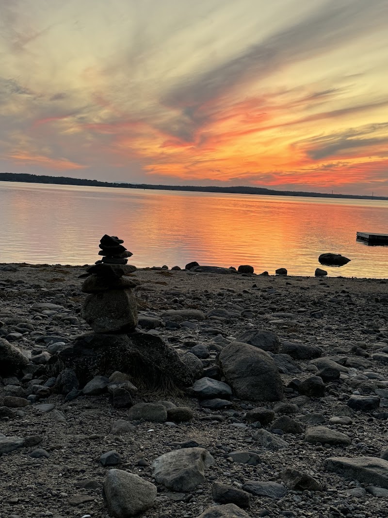 Reach Knolls oceanfront campsite in Acadia National Park at sunset with a rocky pebble beach.