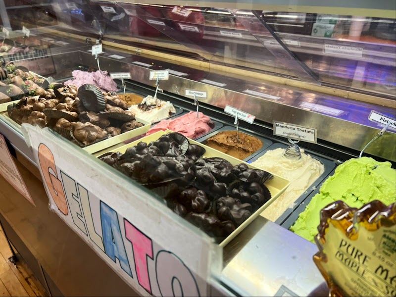 Colorful gelato display and chocolate desserts inside a cafe counter at Acadia National Park.