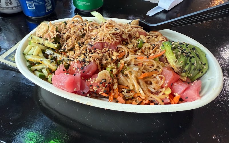 Poke-style noodle bowl with tuna, avocado, cucumber, sesame seeds, and fried onions in Acadia National Park.