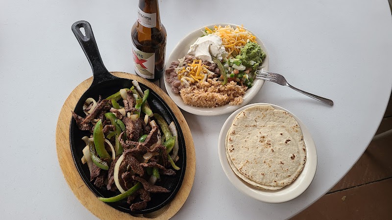 Beef fajitas with peppers and onions, rice, beans, and tortillas at a dining venue in Big Bend National Park.
