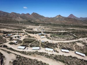 Desert campground with row of simple cabins and dirt roads in Big Bend National Park near Terlingua Ranch.