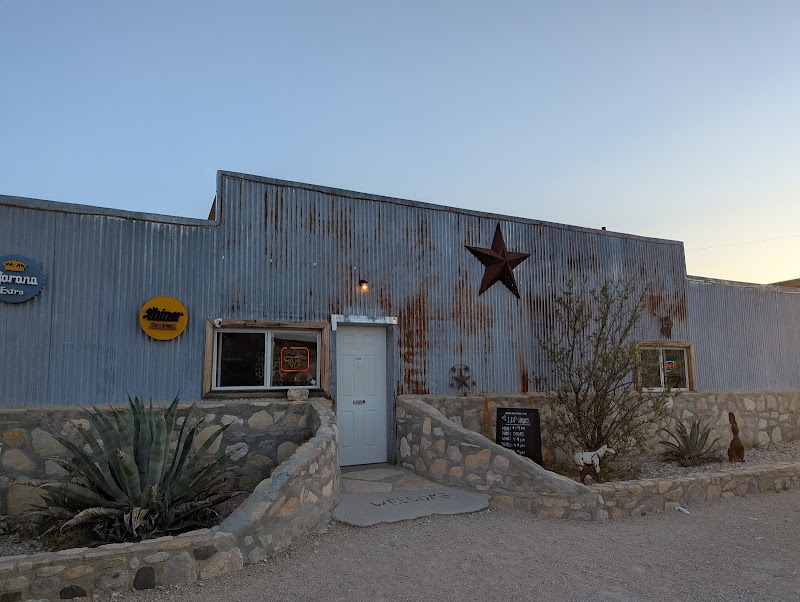 Rustic corrugated metal building with a rusted star on the facade, a small eatery near Big Bend National Park in Texas.