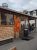Wood-paneled restaurant storefront in Acadia National Park with a grill sign and string lights outside.