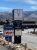 Antler logo lodge sign in Gardiner, Montana, with mountain backdrop near Yellowstone National Park.
