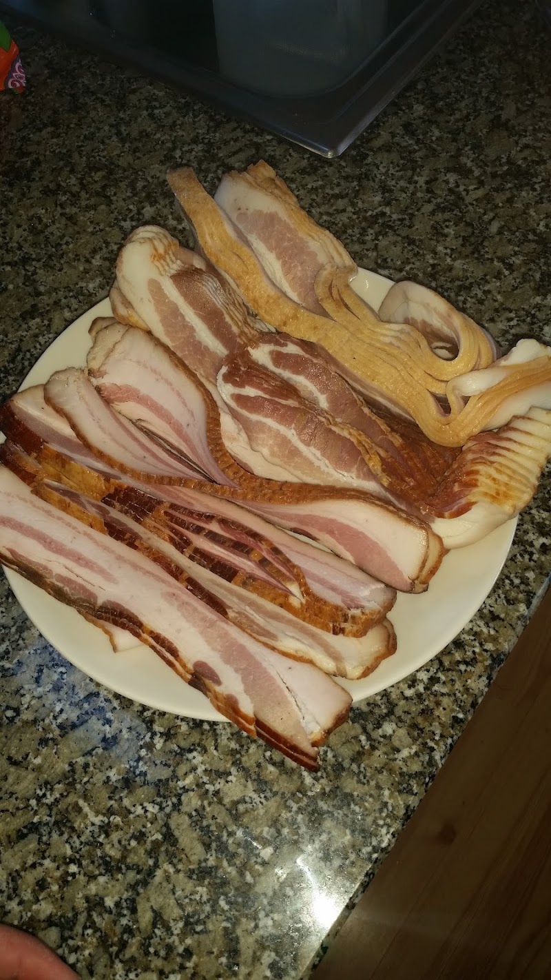 Sedgwick, Acadia National Park plate of thick-cut bacon slices arranged on a kitchen counter in a lodge or cabin.