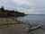 Kayaks rest along the rocky shoreline at Corea village, a scenic spot in Acadia National Park