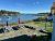 Bar Harbor waterfront picnic area in Acadia National Park with boats moored in a calm harbor.