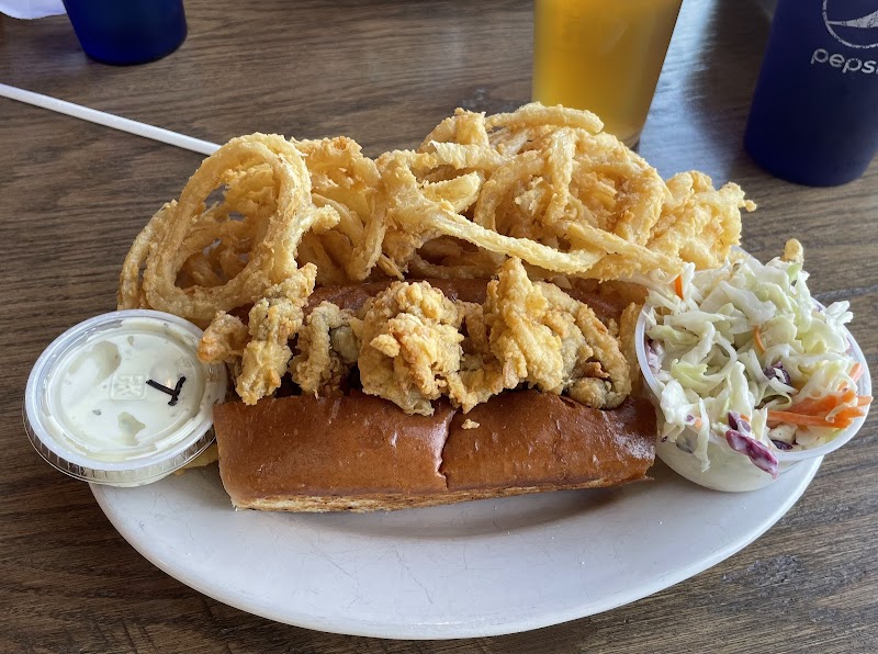 Seafood platter with fried calamari and onion rings beside coleslaw at Acadia National Park.