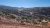 Rugged desert landscape around Area BFE in Arches National Park, featuring red rock hills, scrub, and distant mesas.