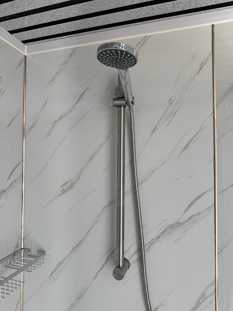 Shower stall with a rainfall-style head in a campground bathroom at Big Bend National Park.