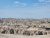 Rugged Badlands National Park landscape from a high overlook showing layered, eroded formations and a wide horizon.