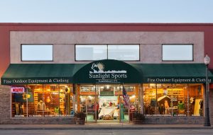 Outdoor equipment storefront in Yellowstone National Park displaying gear and clothing in the window displays
