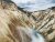 Lower Falls of the Yellowstone River plunges through a colorful canyon in Yellowstone National Park.