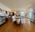 Historic dining room interior in Bar Harbor, Maine, within Acadia National Park showcasing bright wood floors and elegant upholstery.