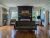 Historic interior room in Acadia National Park, featuring a dark fireplace and a vintage green sofa.
