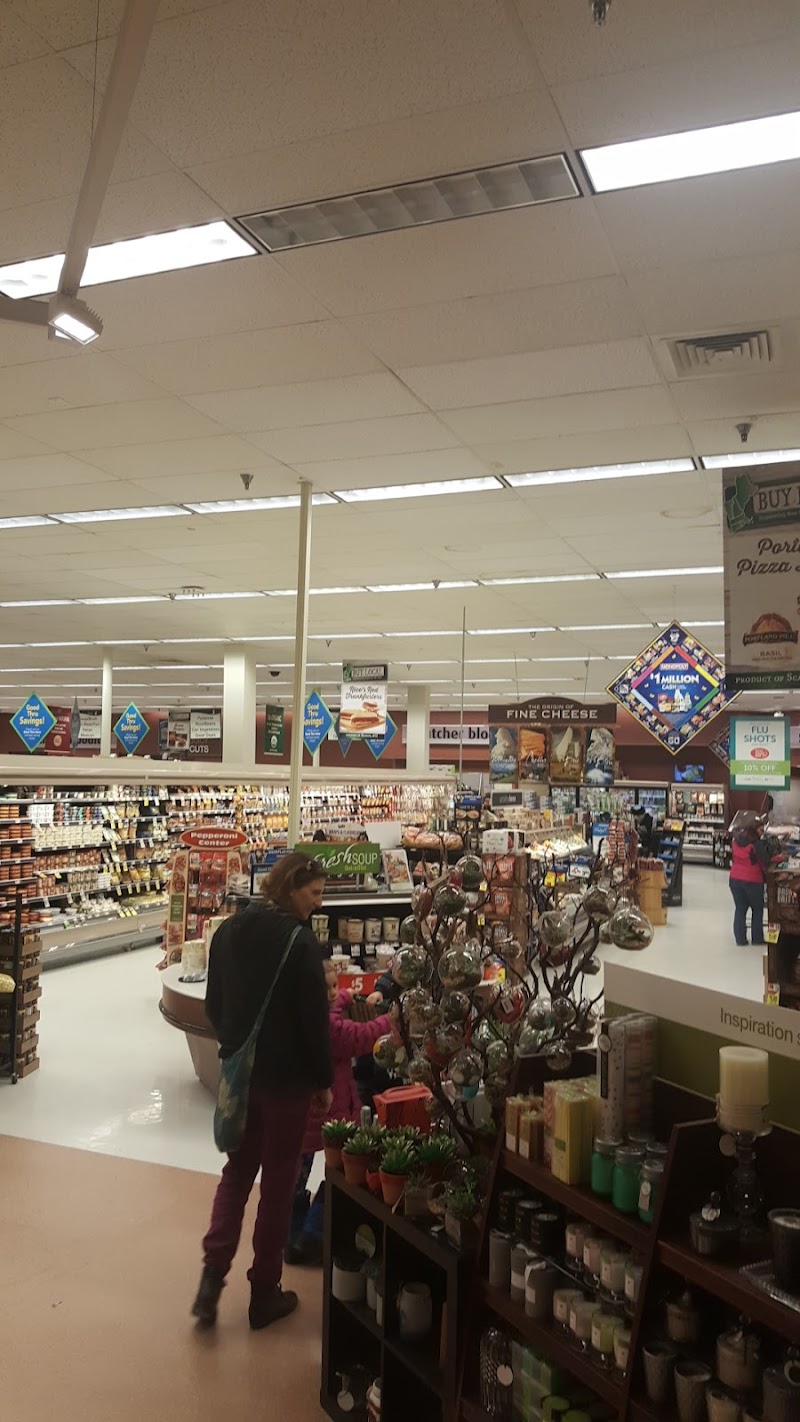 Inside a park gift shop in Acadia National Park, shelves display candles, decor, and souvenirs.