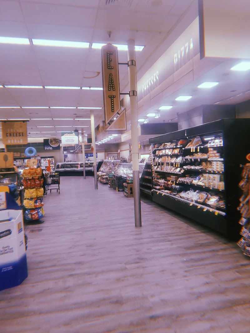 Gift shop interior at Acadia National Park, featuring a bright setup with shelves of snacks and souvenirs.