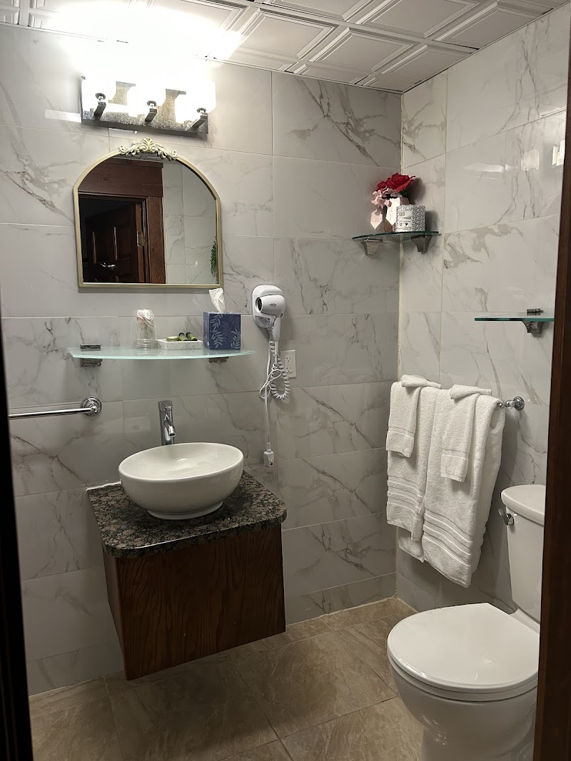 Modern guest bathroom with vessel sink and granite countertop in a lodge room within Acadia National Park.