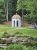 White domed gazebo at the Wild Gardens of Acadia, a tranquil floral display within Acadia National Park.