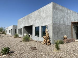 Lodging facility exterior in Big Bend National Park, a modern concrete structure amid desert landscaping.