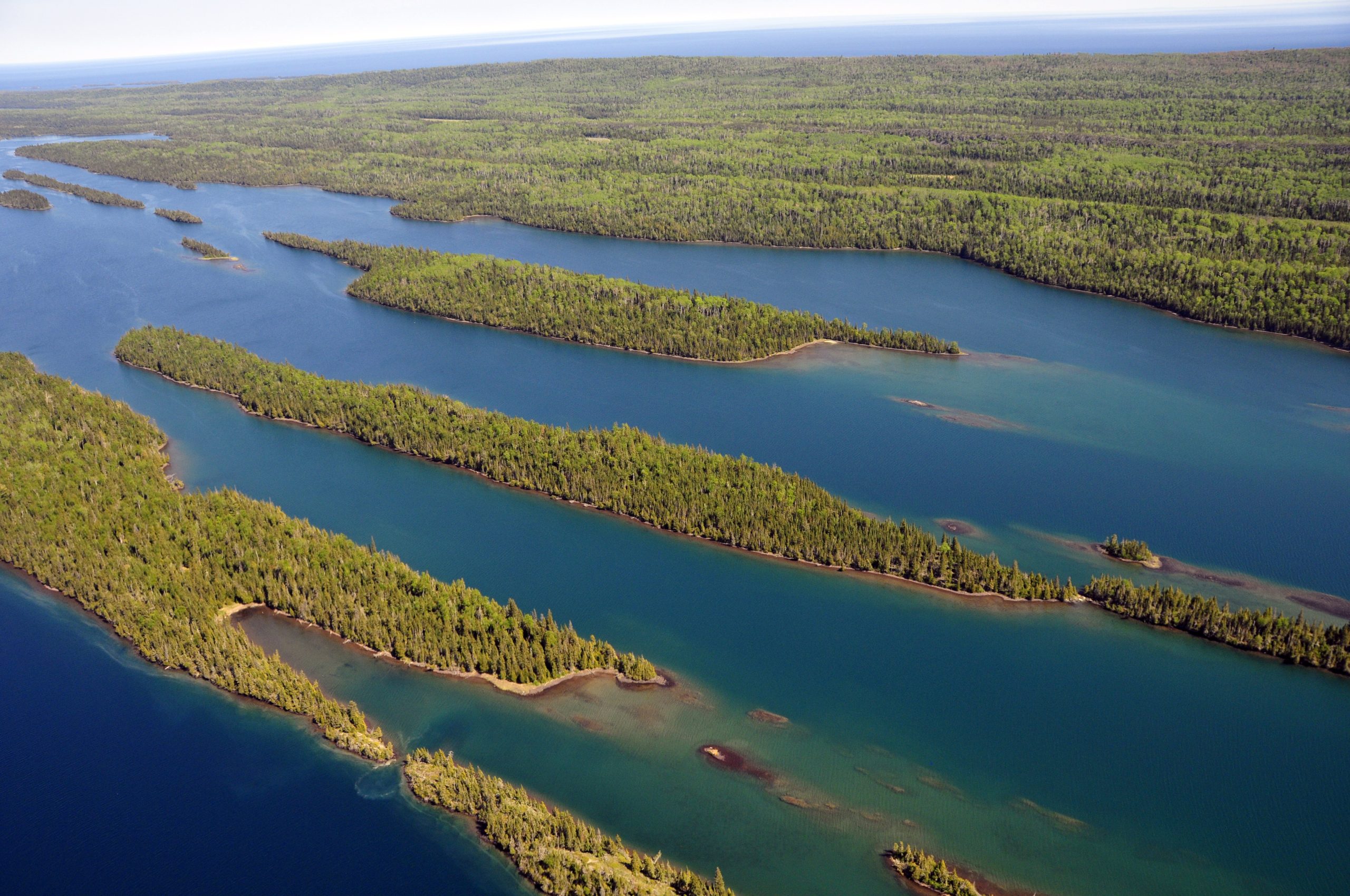 Aerial view of forested island archipelago and inlets across Isle Royale National Park on Lake Superior.