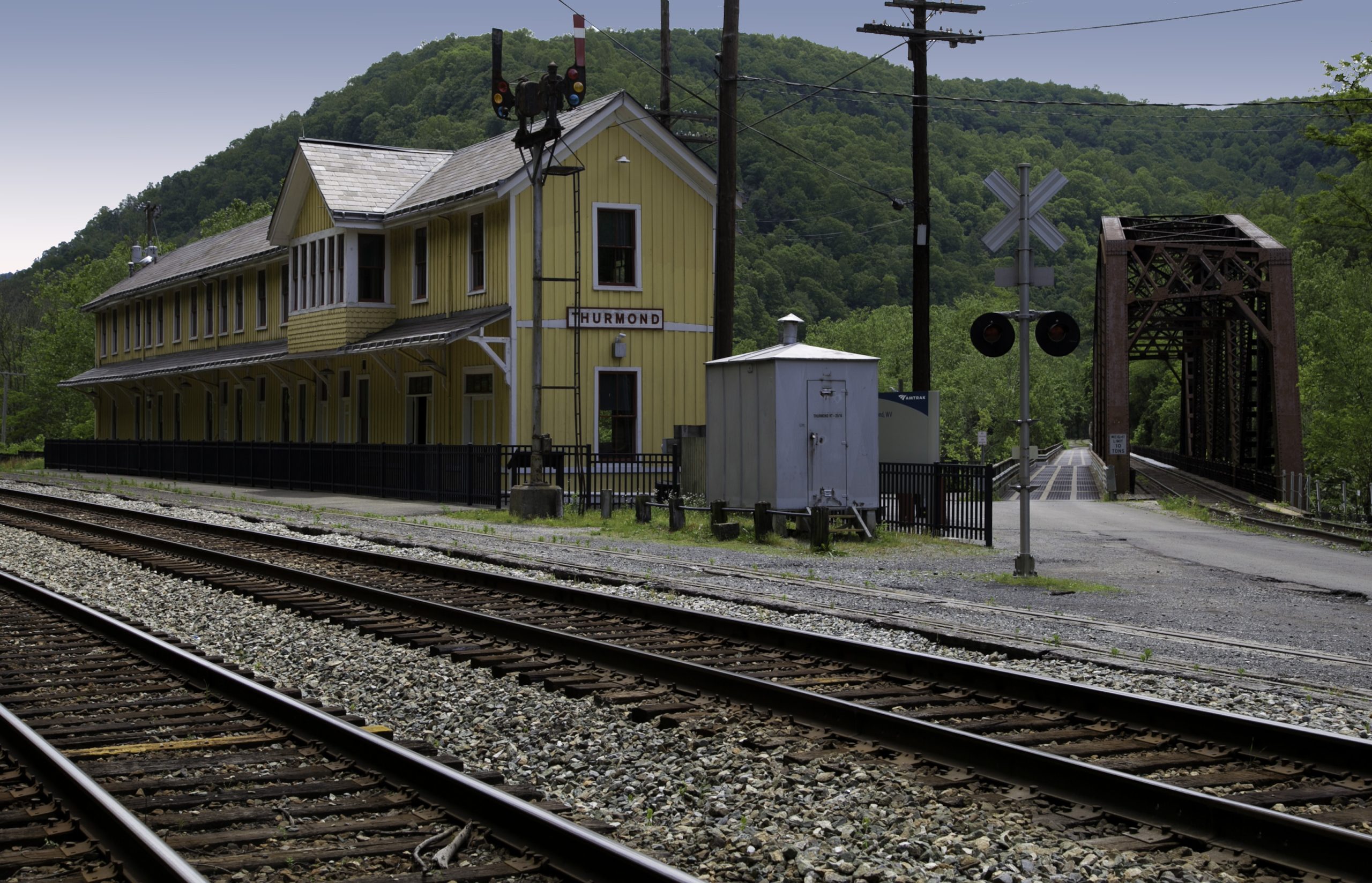 Hurmond railroad station beside a yellow, historic depot at New River Gorge National Park & Preserve.