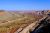 Capitol Reef National Park panorama over the Waterpocket Fold, showing eroded cliffs and a desert valley.