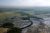 Aerial view over Everglades National Park shows winding mangrove channels and flooded sawgrass plains.