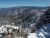 Snow-covered shrubs frame a sweeping, rugged ridge line in Great Smoky Mountains National Park during winter.