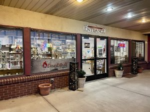 Restaurant storefront at Bryce Canyon National Park near the park entrance, featuring a brick façade and illuminated signage.