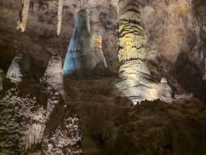 Within Carlsbad Caverns National Park, stalagmites and columns rise from the cave floor inside the Visitor Center area.