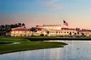 Doral resort near Biscayne National Park framed by palm trees at sunset in Florida, lakeside course.