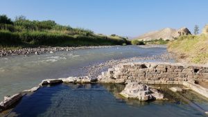 Hot Springs Trailhead at Big Bend National Park sits along a shaded riverside with stone pools.