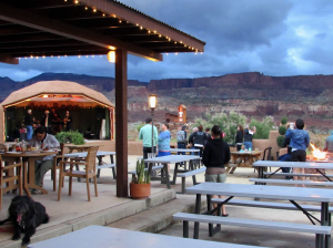 Rim Rock Patio at Capitol Reef National Park offers sunset views over red canyon cliffs with outdoor dining and string lights.