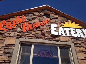 Stone-faced restaurant storefront at Black Canyon of the Gunnison National Park, Colorado, with an OPEN sign in the window.