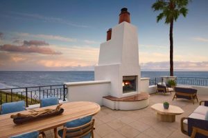 Oceanfront terrace with a stone fireplace and lounge seating overlooking the Pacific along the Channel Islands coastline, Channel Islands National Park.