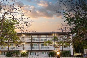 Lodging building with exterior balconies at Channel Islands National Park, showing a dusk sky.