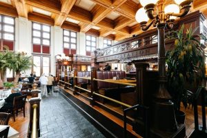 Interior view of a Union Station–style dining hall in Congaree National Park, featuring wood paneling and booths.