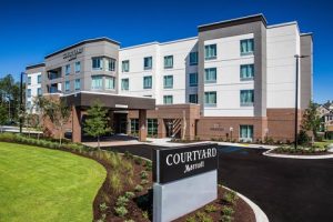 Modern hotel exterior near Congaree National Park in Cayce, a contemporary lodging facility.