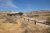 Delicate Arch viewing area near a rustic log cabin in Arches National Park