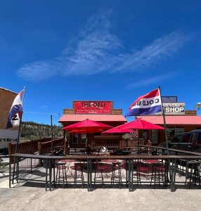 The Deli storefront with red umbrellas and outdoor seating at Bryce Canyon National Park.
