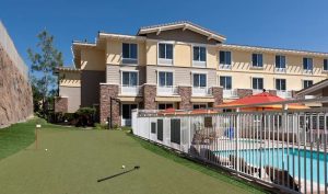 Exterior of a hotel in Agoura Hills with a pool, near Channel Islands National Park.
